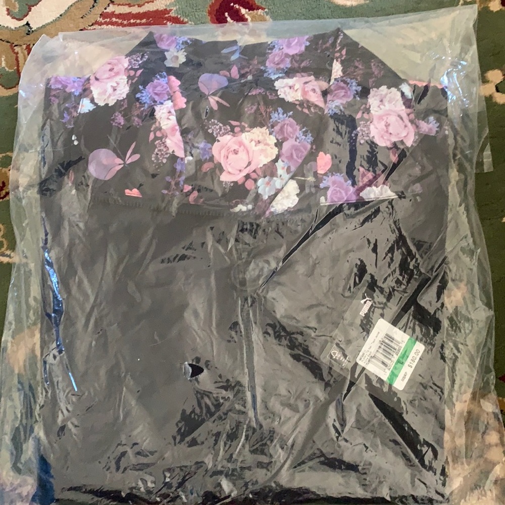 Ladies size large Puma track jacket. Black with floral design. Brand new.